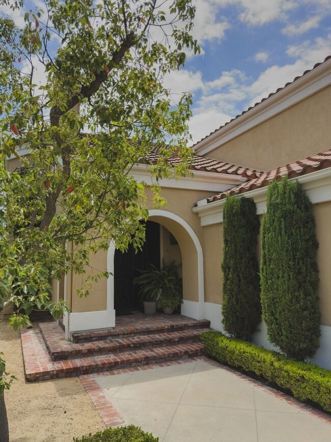 Building Photo - Elegant Mediterranean Living with Private Pergola Garden & Resort Amenities