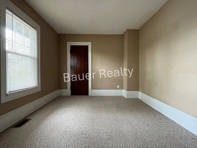 Building Photo - Three bedrooms, one and a half baths