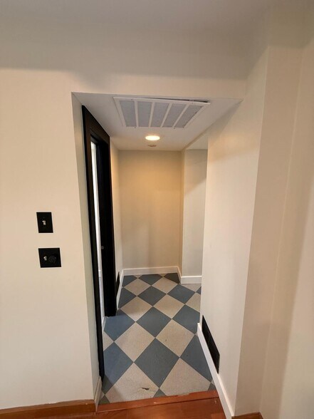 Colorful flooring leads into the brand new kitchen area - 327 Hudson Ave