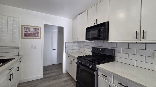 Building Photo - Beautifully remodeled pool home situated on a spacious quarter-acre lot