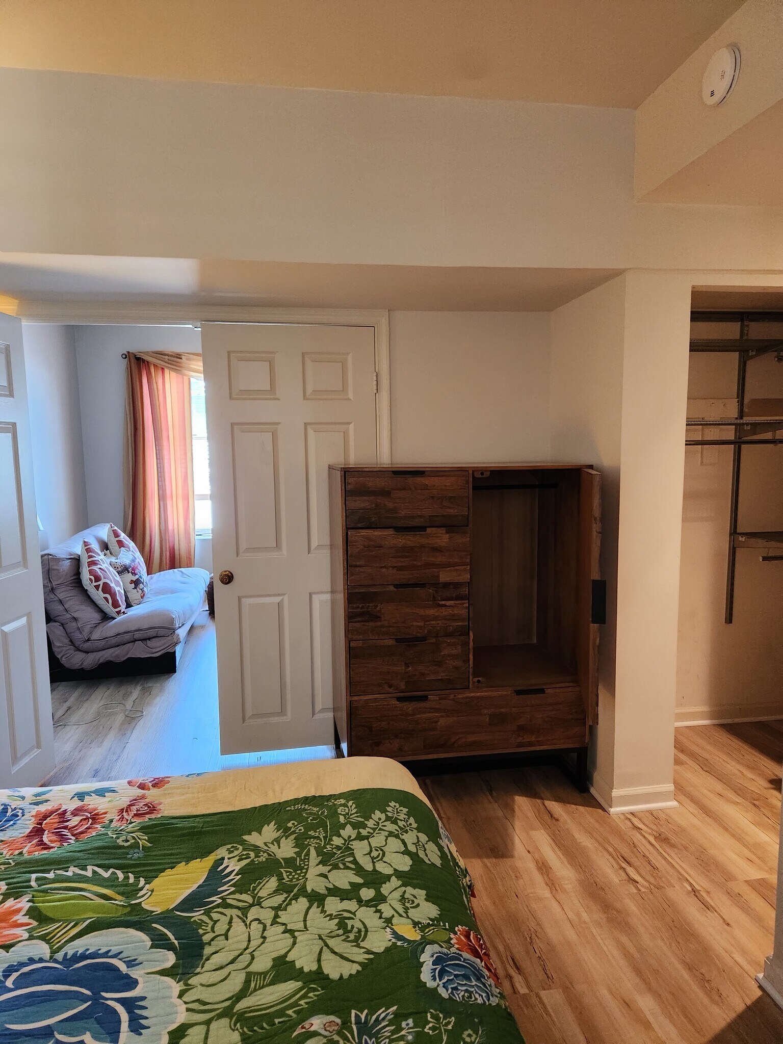 Bedroom opens to living room. Chiffrobe in the bedroom contains small closet space. - 1737 P St NW