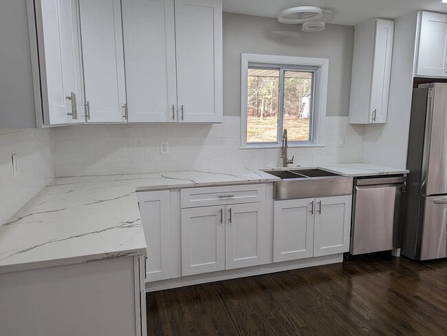 Building Photo - this contemporary & brightly remodeled 2,400 sqft home