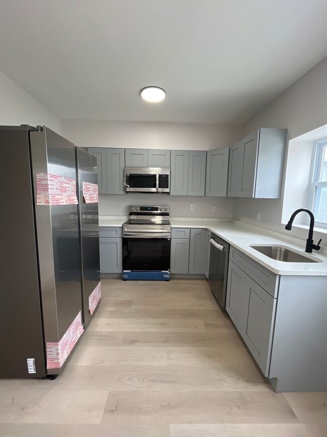 Building Photo - A real stunner! The full renovation is the first thing you'll notice..