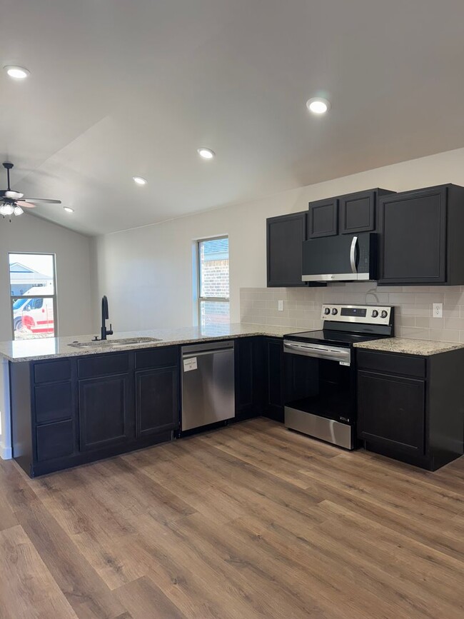 Building Photo - Brand New Construction 3/2/2  1/2 off spec...