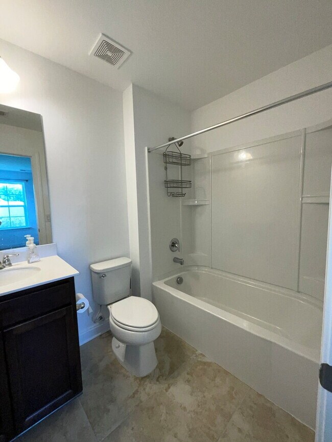 Building Photo - "Spacious 4-Bed Oasis with Stunning Lake V...