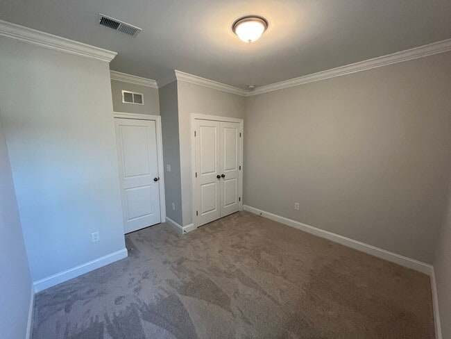 Building Photo - Newly Built 4BD, 3BA Cary Townhome with Modern Amenities and Screened-In Patio