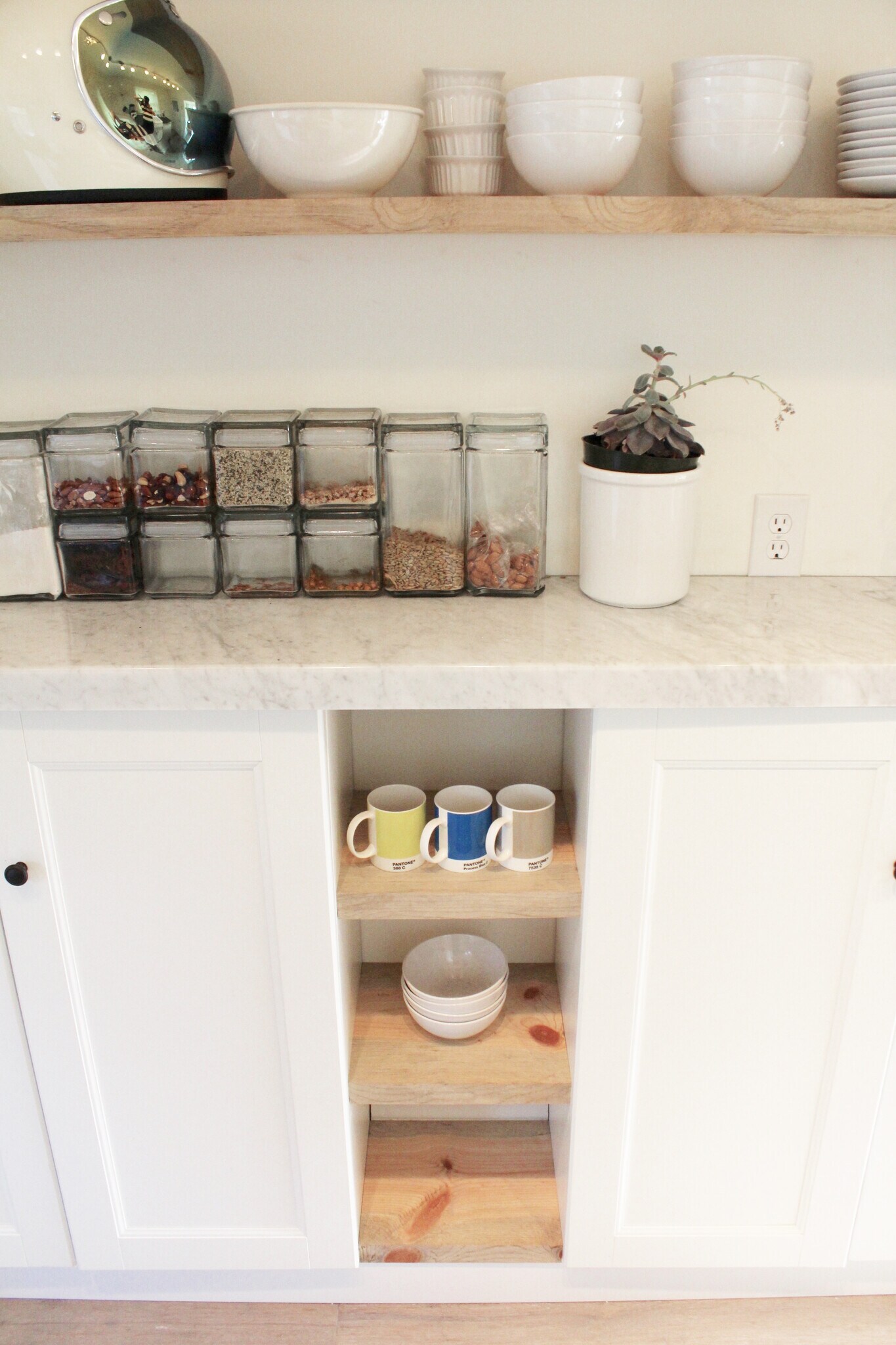 Open and closed shelving atop real Carerra Marble. - 2635 NE 30th Ave