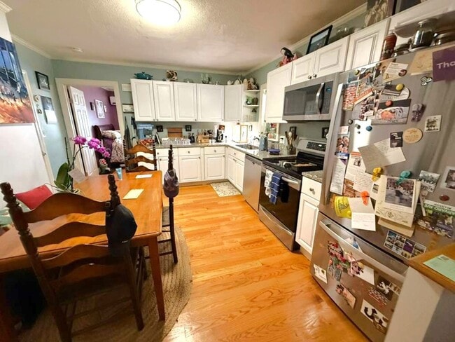 Building Photo - Spacious and updated 3-bedroom condo just 2 blocks from Airport T Station!