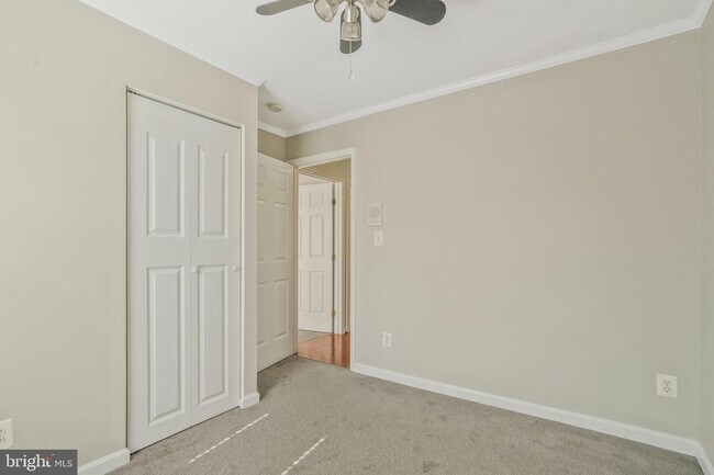 Building Photo - This beautifully maintained brick-front, three-level townhome is located in a highly sought-after...