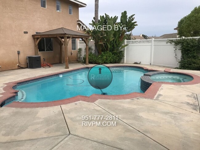 Building Photo - Beautiful 4-Bedroom Home with Pool & Garde...