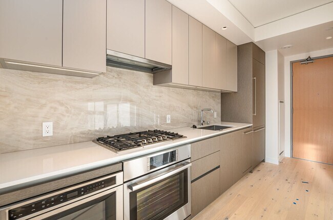Building Photo - Urban Oasis at Spire Condominiums – Modern...