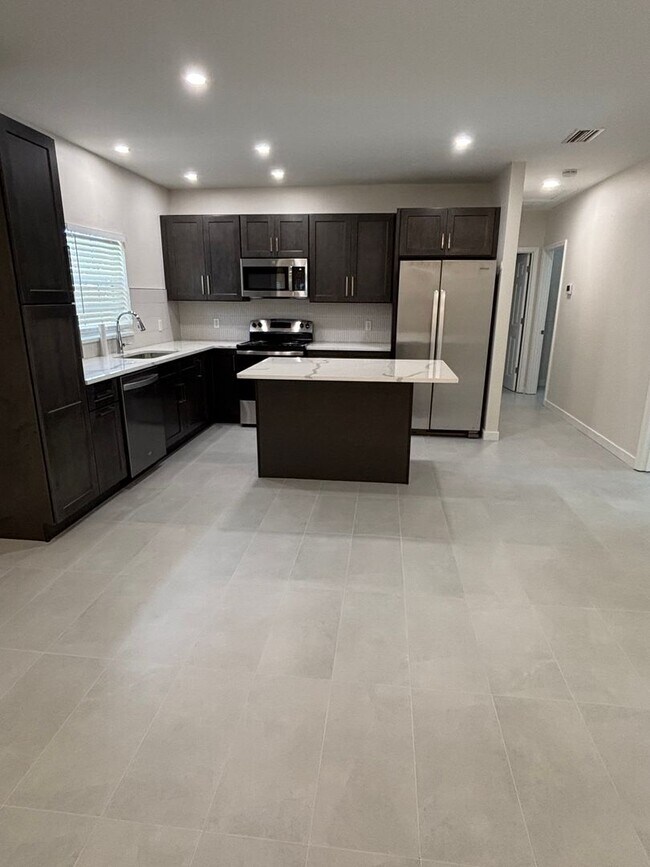 Building Photo - A MUST SEE THREE BEDROOM DUPLEX