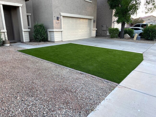 Remodeled front yard with premium turf - 2591 E Bellerive Dr