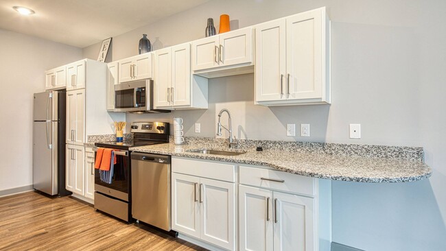 The Orbit kitchen designer shaker style cabinetry with tons of storage - Ellipse Urban Apartments