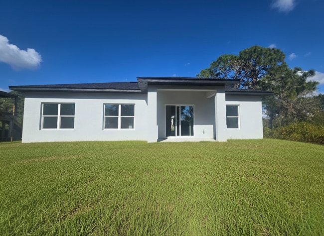 Building Photo - Brand New 4/2/2- South Lehigh Acres