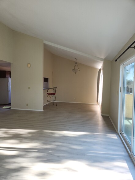 Living Room with view of Dining Room and Kitchen Doorway - 1208 Roswell Ave