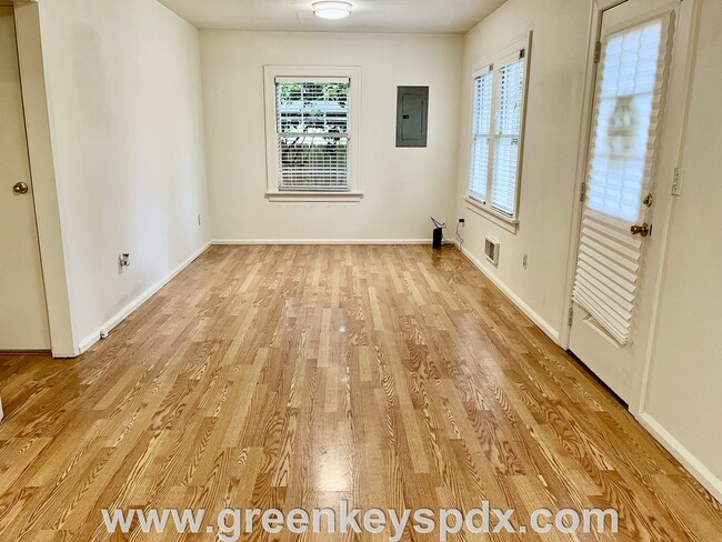 Building Photo - This 3-bedroom 1-bathroom house has a large front yard and a mostly fenced backyard.