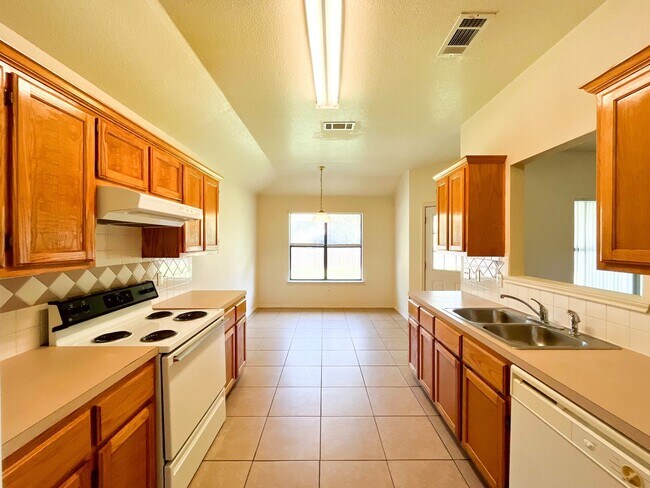 Building Photo - Available NOW!!!! Open floor plan features living room with fireplace, dining area, and large kit...
