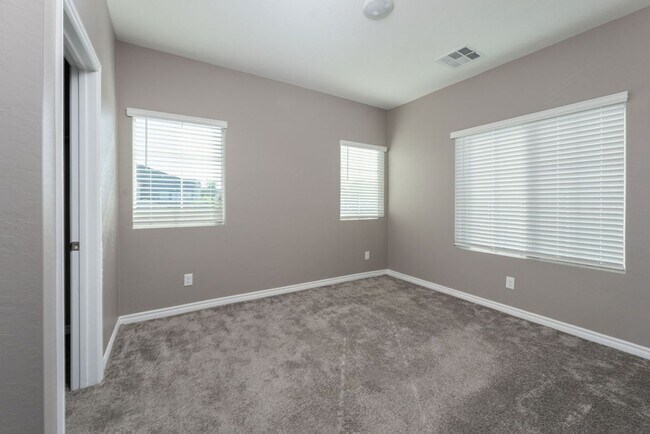 Building Photo - Modern Henderson Townhome with Loft & Resort-Style Amenities