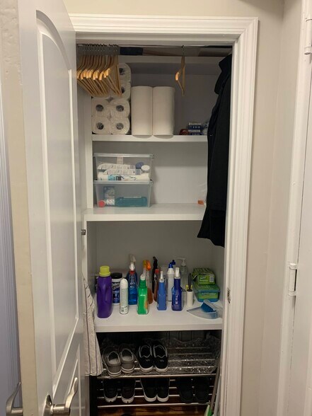 Large deep entryway closet with built in storage and garment bars - 160 72nd St