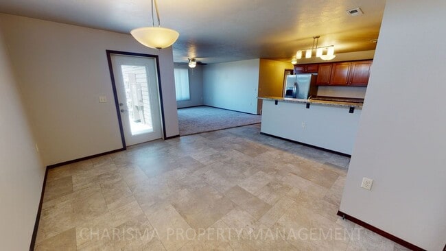 Building Photo - LOWER LEVEL 3 BEDROOM, 2 BATH TOWN HOME, INDIVIDUAL ENTRANCE, DOUBLE ATTACHED GARAGE, PET FRIENDLY