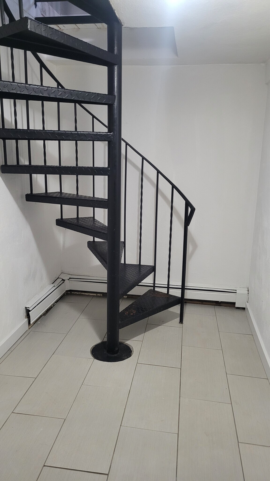 Spiral stairs to lower level - 881 Broadway