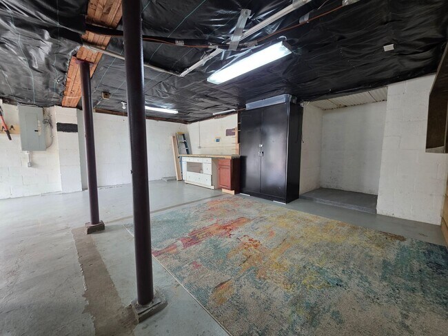 Building Photo - Charming 2BR with Walk-Out Basement, Fenced Yard & Flexible Murphy-Bed Office