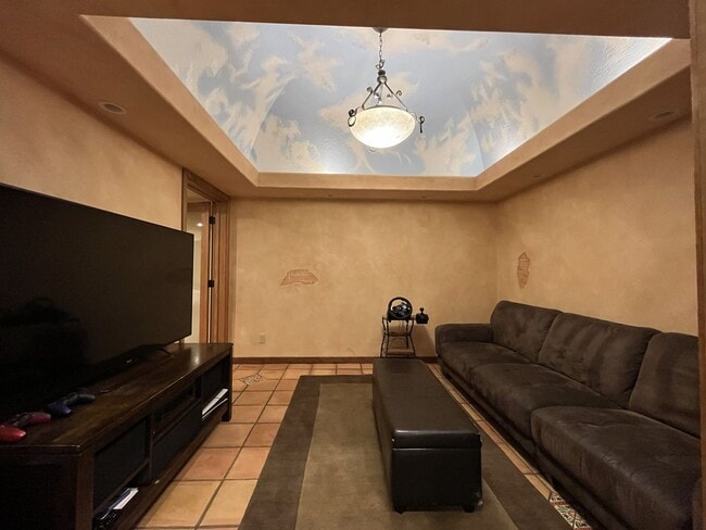 Building Photo - One-of-a-Kind Custom Home with Wall of Windows, Stone Fireplaces, Expansive Entertainment Space &...
