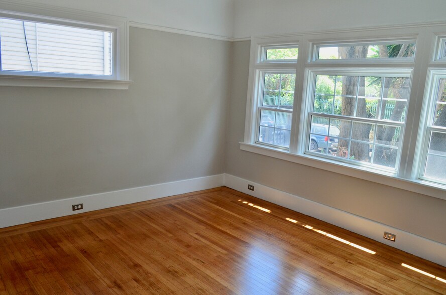 primary bedroom windows look out to Merrimac St. - 568 Merrimac St