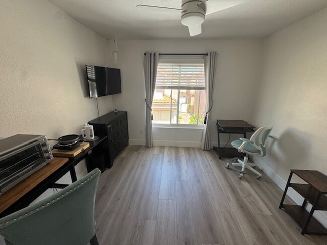 Building Photo - Furnished Bedroom rental with Bonus Kitchenette and office room
