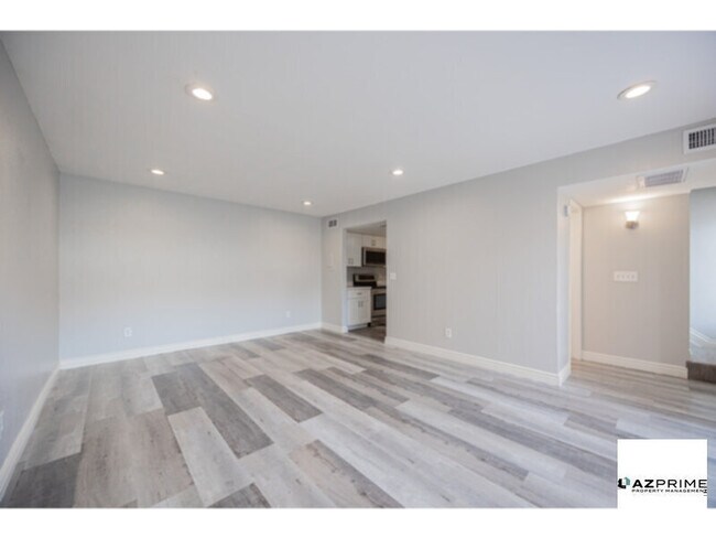 Building Photo - Your Next Home Awaits in this Beautifully Updated 2/1.5 Townhome in Phoenix!
