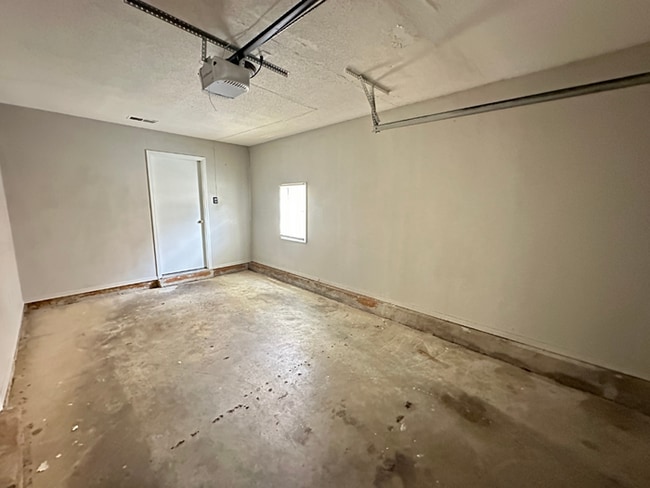 Building Photo - Charming 3BR/2BA Near Southwind | Soaring Vaulted Ceilings, Rustic Fireplace & Garage