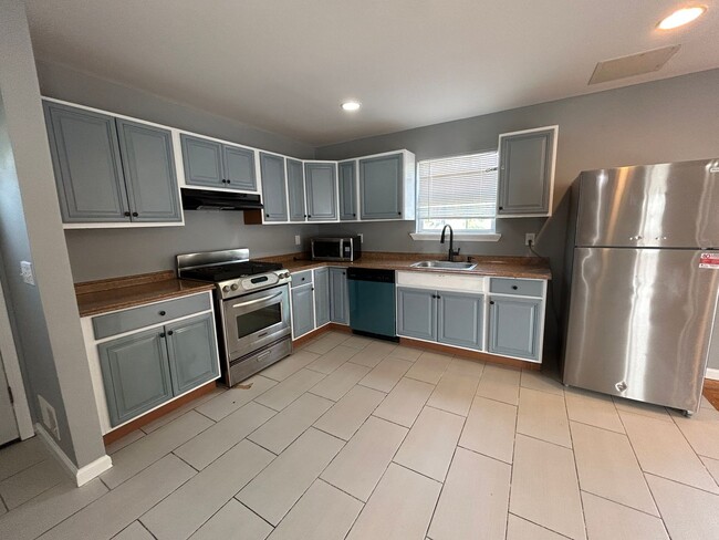 Building Photo - Discover Your Dream Home in Neptune: Spacious 4-Bedroom, 2.5-Bath with Private Backyard and Drive...