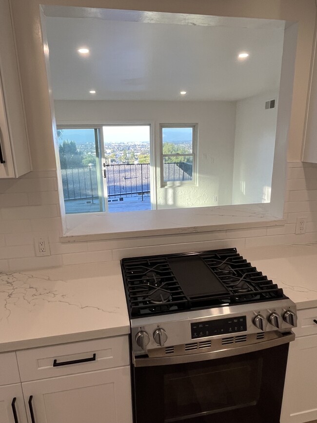 Kitchen with pass through window and view of LA - 2053 264th St