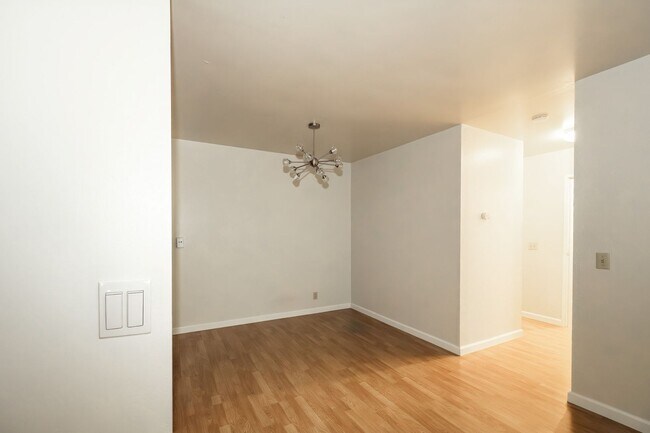 Building Photo - Peaceful Forest-View Condo with Fireplace & Private Balcony in Golden Oaks