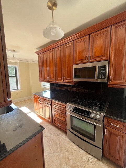 Kitchen with Range and Microwave - 2000 N Lincoln Park W