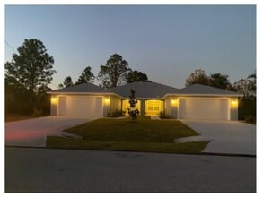 Building Photo - Spacious 4 bedroom/2 bath/ 2 car garage Duplex. www.WeRentSunshine.com