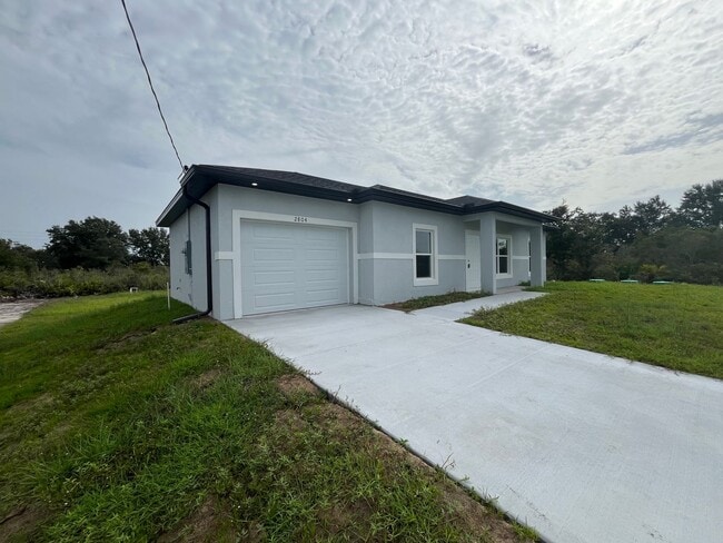 Building Photo - NEW CONSTRUCTION- Modern 3 Bed / 2 Bath Home in Lehigh Acres