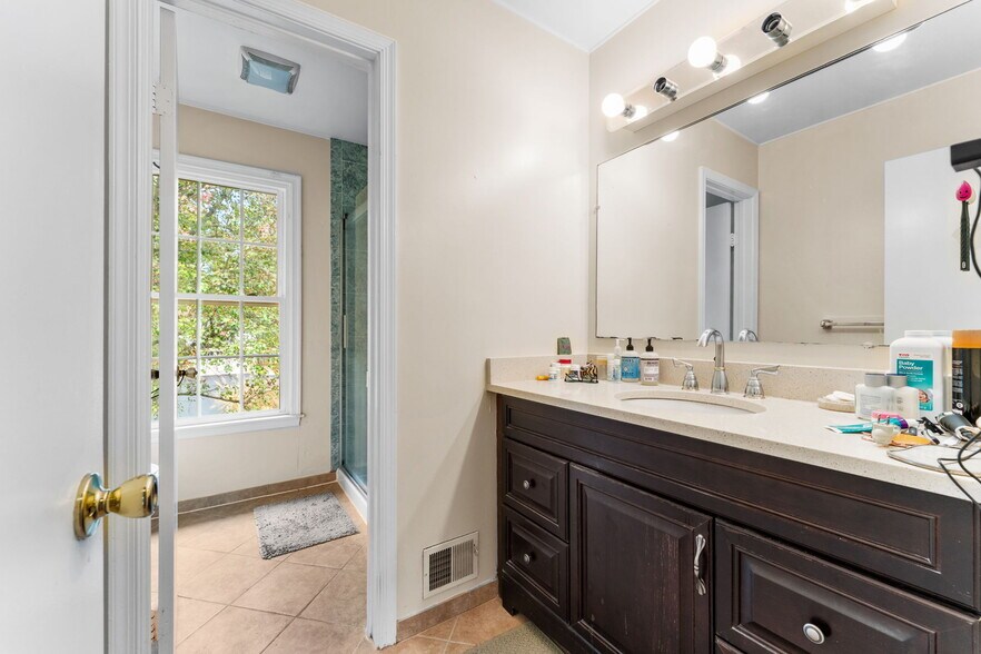 3rd full bathroom has large vanity - 9 Snug Hill Ct