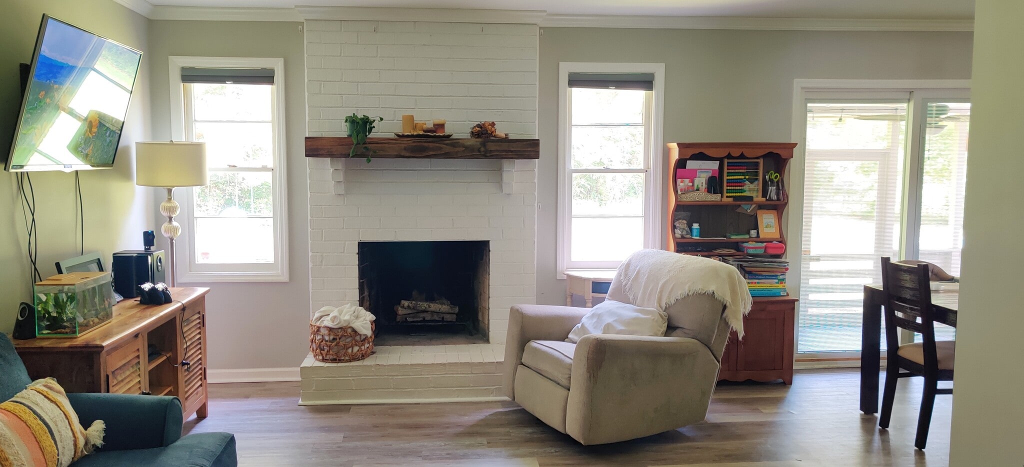 window lined wall and fireplace - 102 Anna Ct