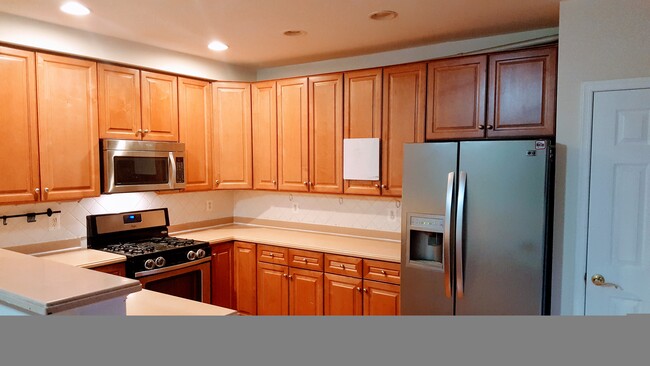 Kitchen with steel appliances - 14605 Illuminati Way