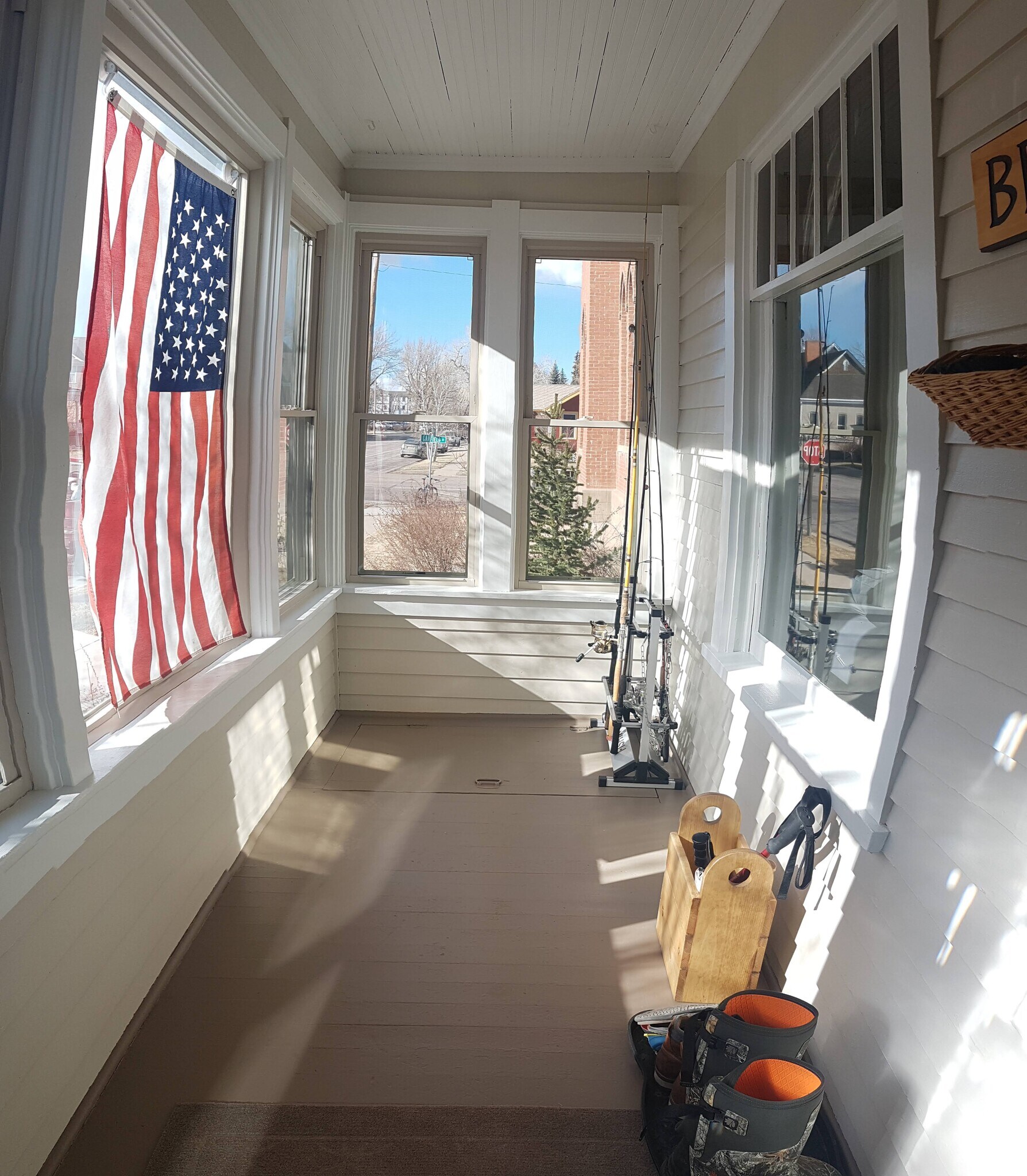 Enclosed front porch with extra storage accessible through the floor - 407 S. 6th Street