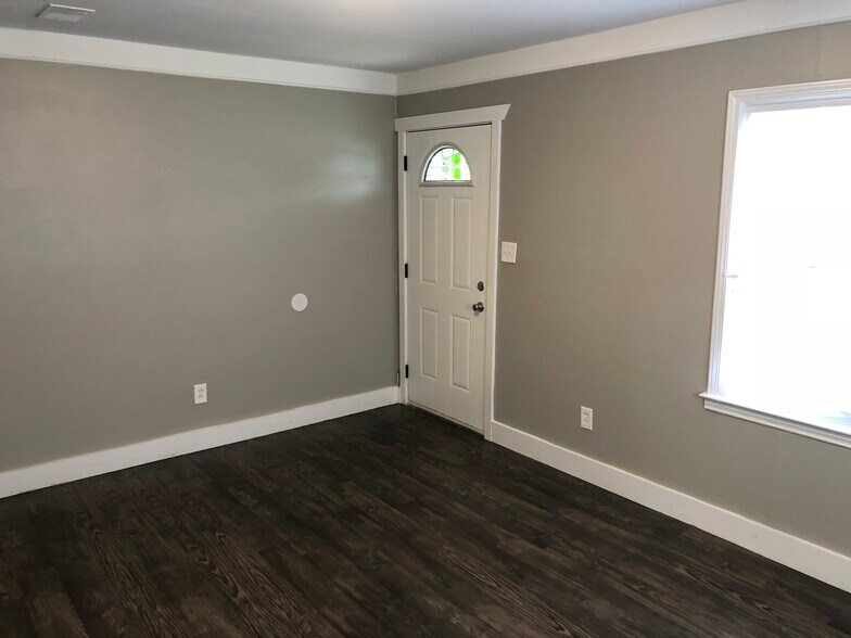 Livingroom - freshly painted, new floor, new doors, new windows, new trim - 18768 Roscommon St
