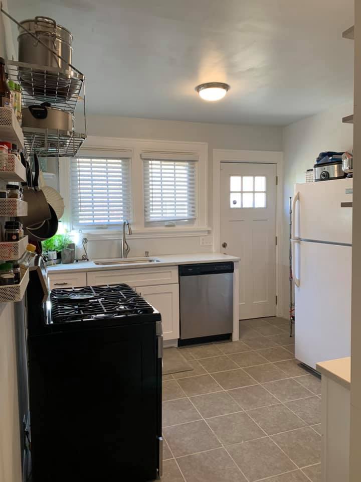 Kitchen (facing east windows), guest bedroom to the right - 1617 Richmond Ave