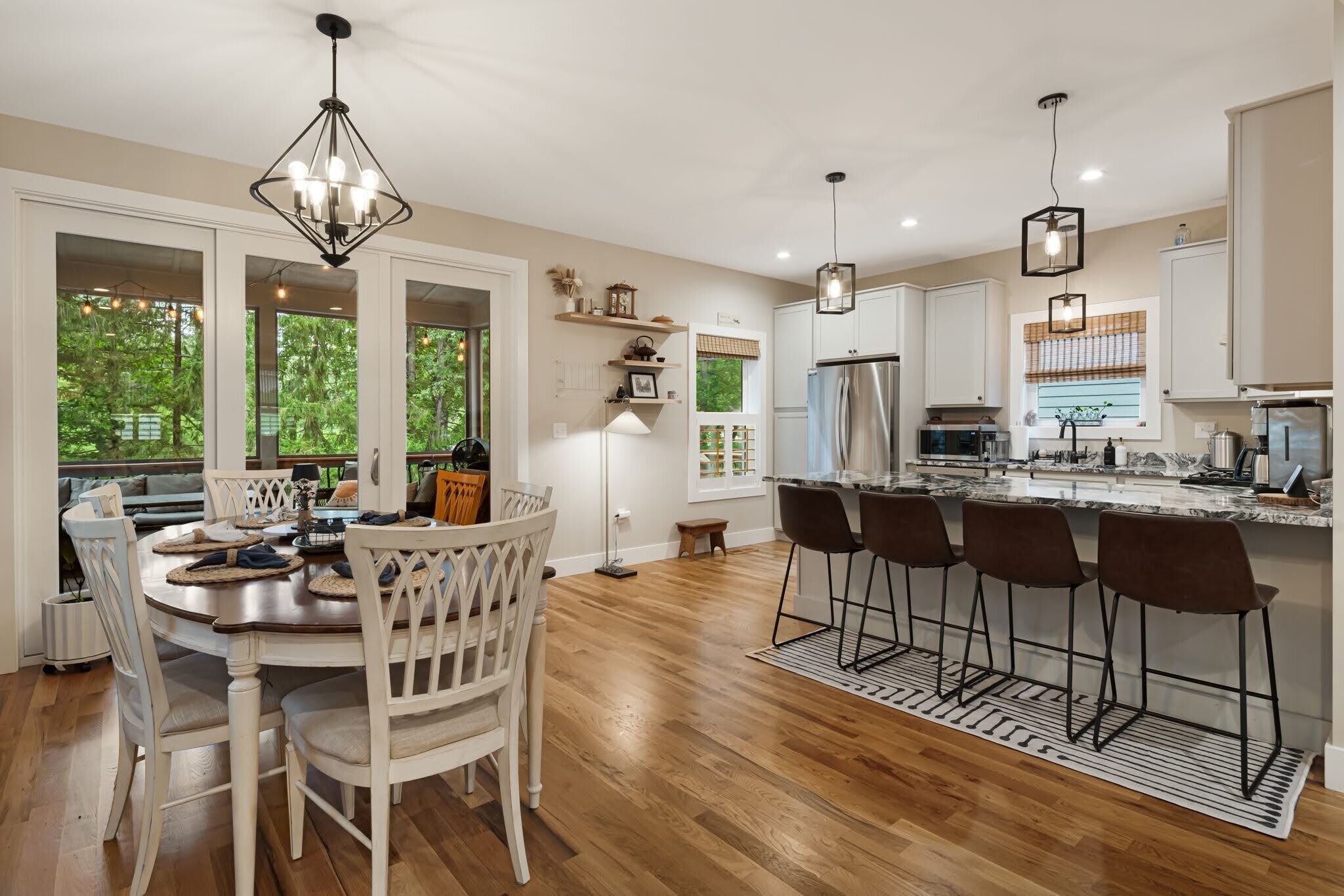 Dining area, bar seating, and kitchen. - 33 Rex Dr
