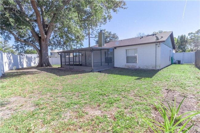 Building Photo - Freshly Painted 3/2 with Fenced Yard & Fireplace!
