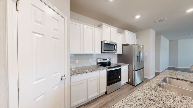 Building Photo - Discover this spacious 4-bedroom, 2-bath home with 3 CAR GARAGE!!!