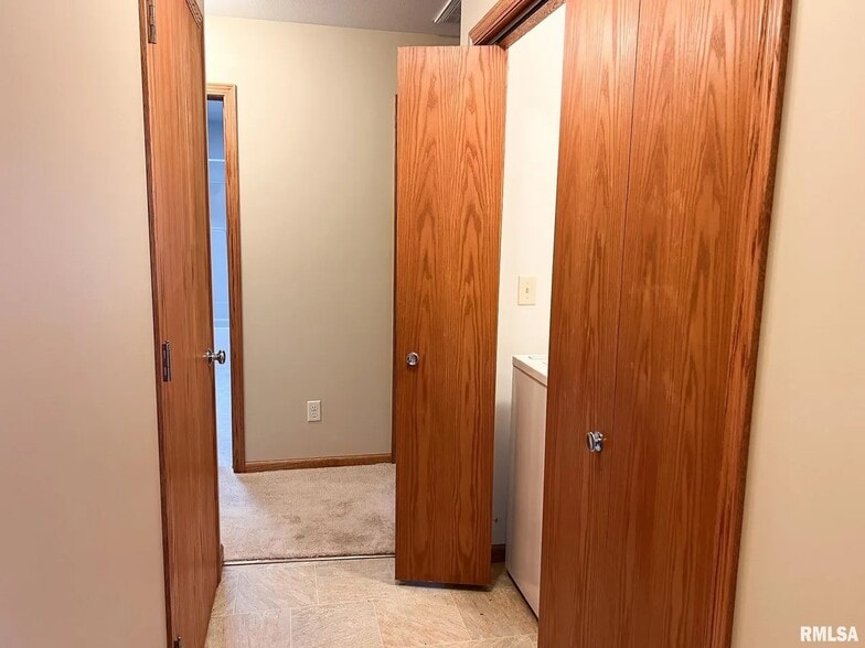 Half bath and Washer/Dryer hallway - 1138 Breeze Way
