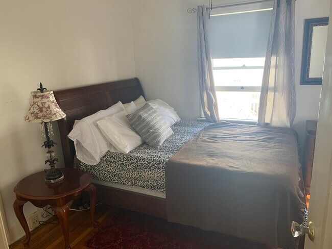 Bedroom queen bed in photo - 2746 C St