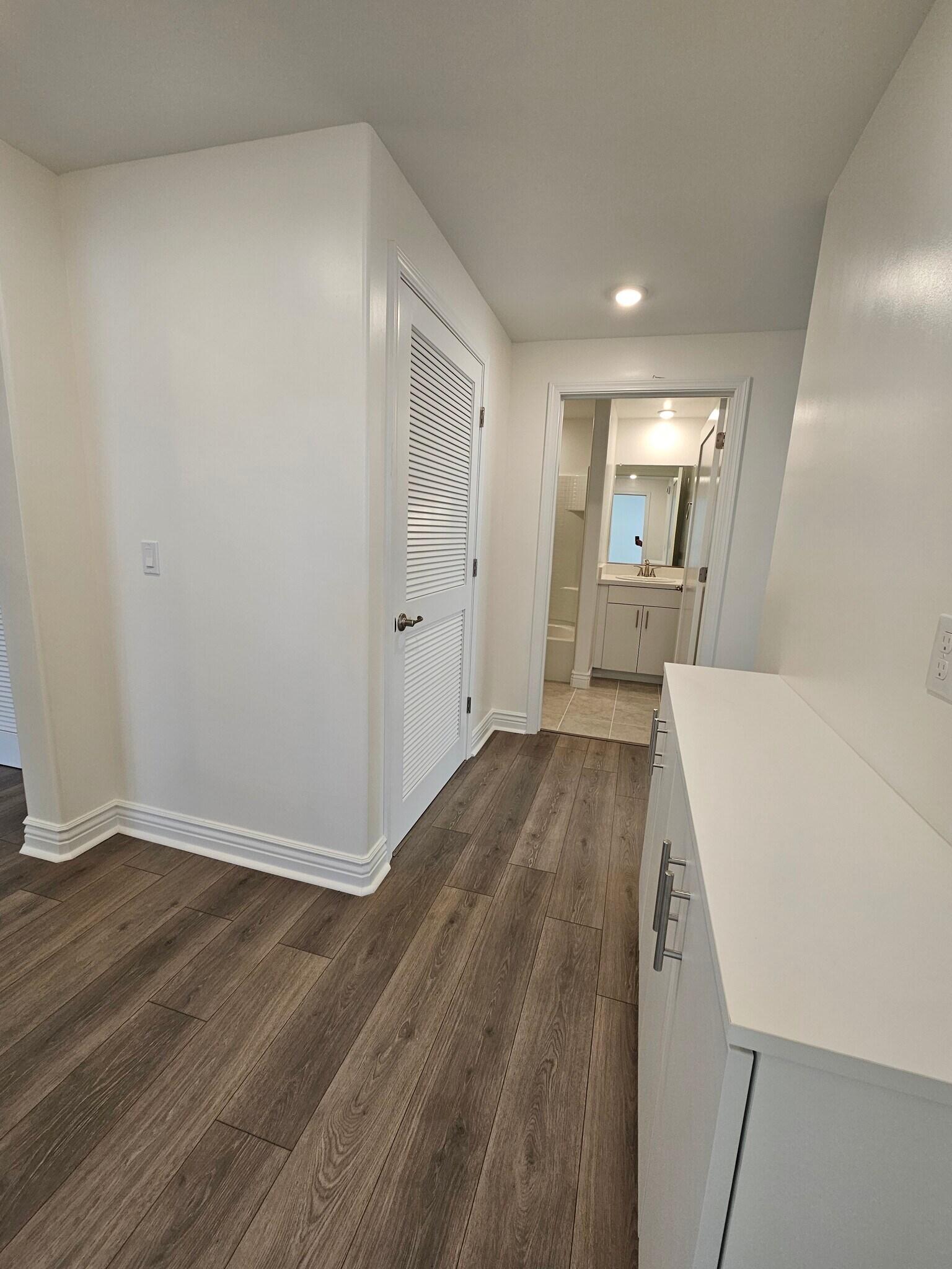 Hall, laundry closet on left, second bath in the back - 925 Madonna Rd